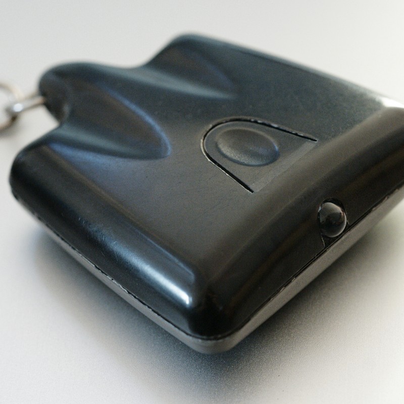 An image of a key fob "TV-B-Gone" universal television remote control with only an Off button.