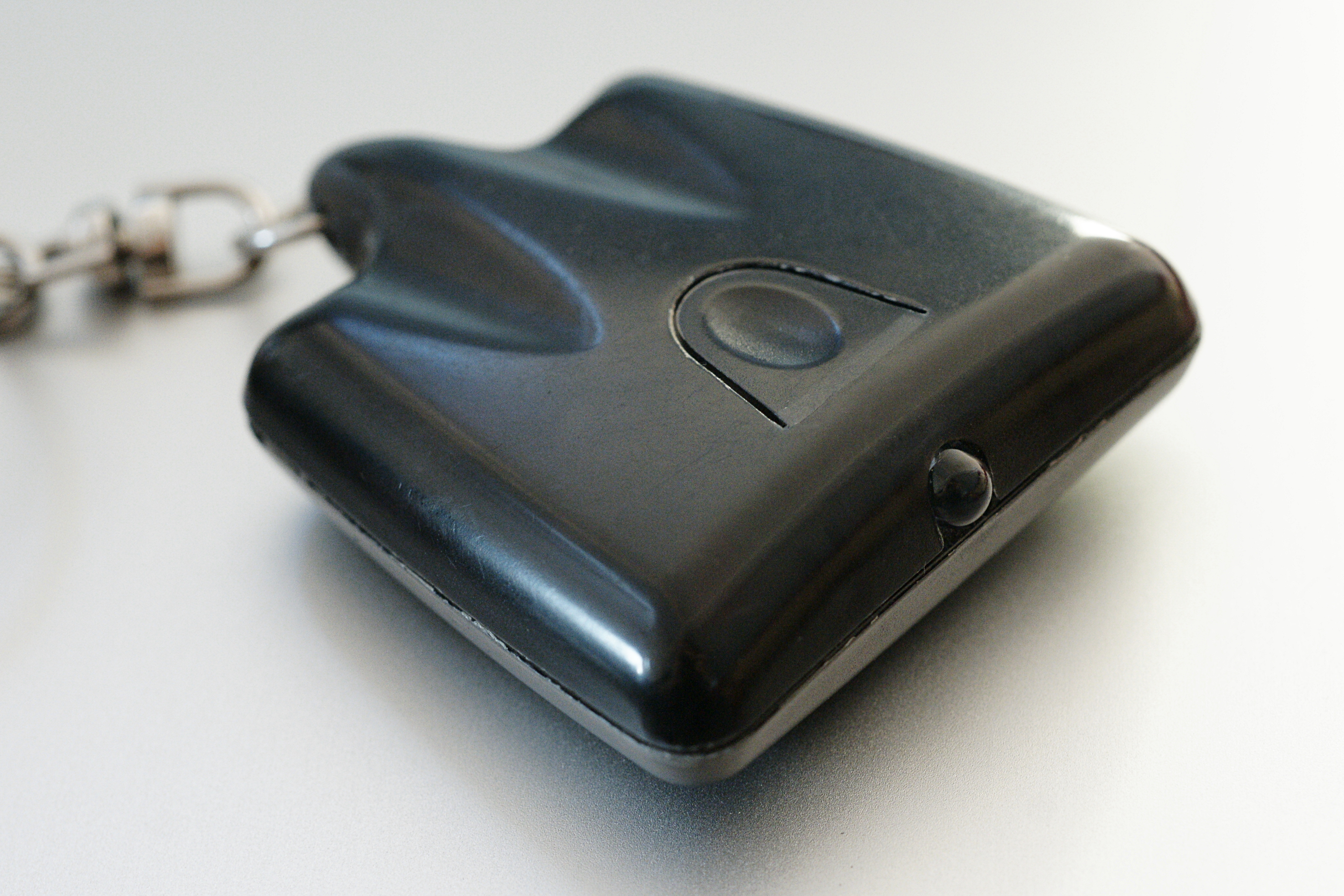 An image of a key fob "TV-B-Gone" universal television remote control with only an Off button.